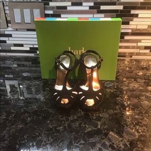 Peep toe, t-strap heel.